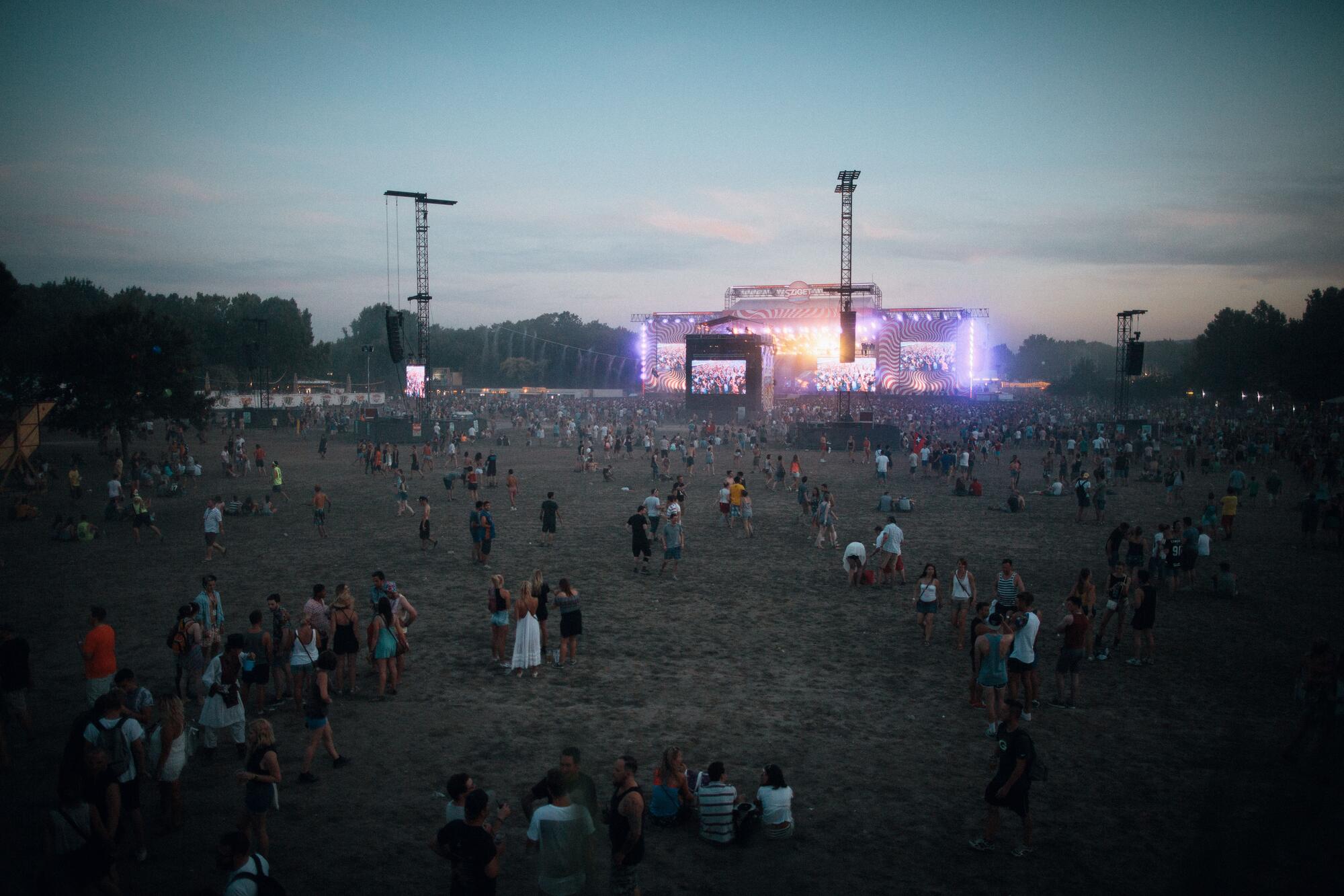 Aerial view of a crowd at an outdoor music festival